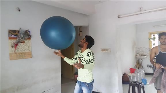 Juggling a Swiss Ball in One Finger - One Hand