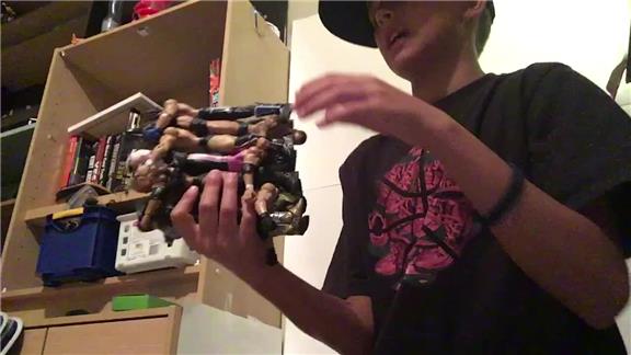Most Wrestling Action Figures Held In One Hand At Once