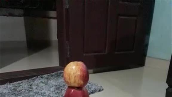 Tallest Apple Tower Stacked on a Smart Phone by a Boy