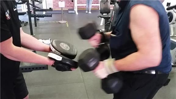 Contact Punching on Pad With a 20 Kilogram Dumbbell in Each Hand