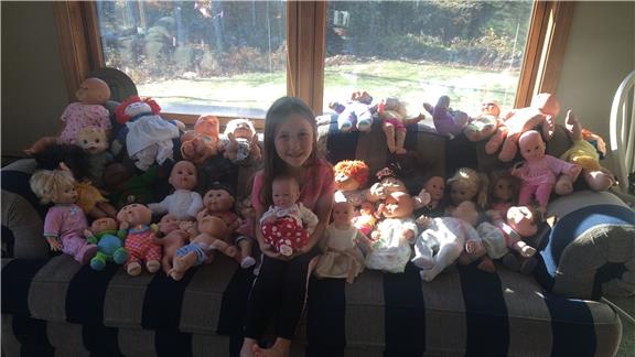 Most Baby Dolls Sitting With A Five-Year-Old Girl