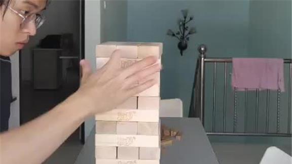FASTEST TIME to REMOVE THREE LAYERS BLOCK by BLOCK FROM a GIANT JENGA TOWER THEN READDING THEM ATOP the TOWER ONE-HANDED 