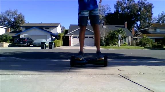 Most Soccer Ball Juggles While Balancing On A Hoverboard