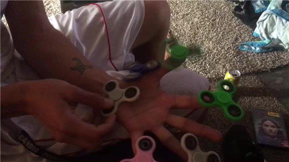 6 Fidget Spinners on One Hand.
