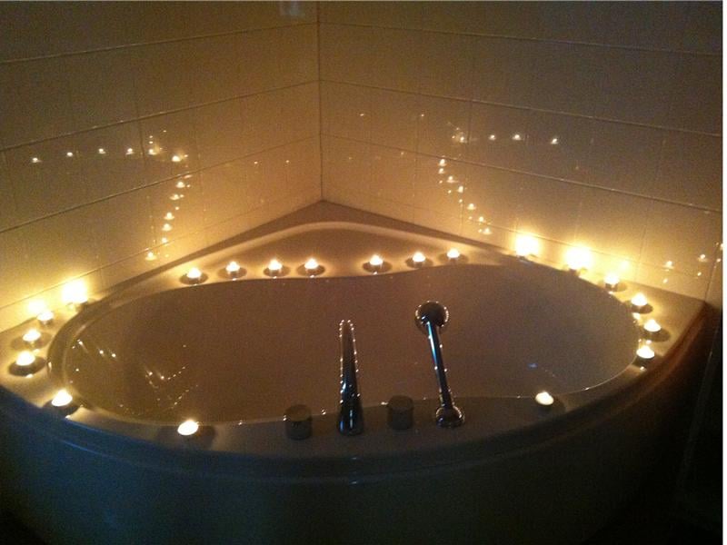 Most Candles Placed Around A Bathtub