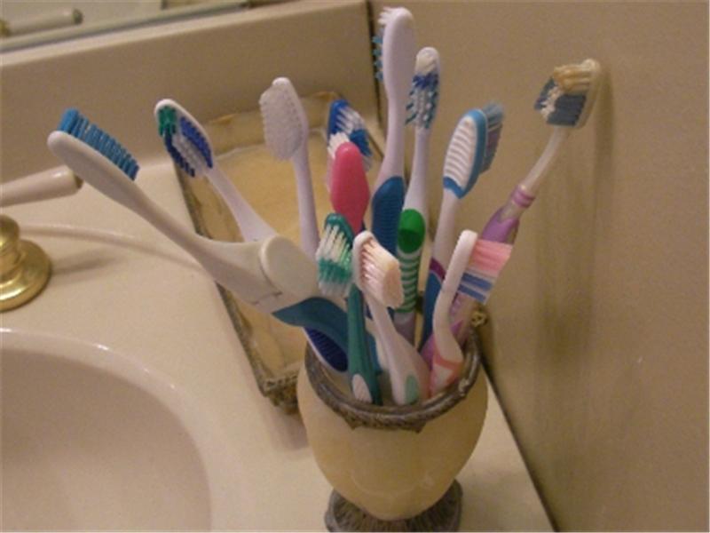 Most Toothbrushes On Bathroom Counter